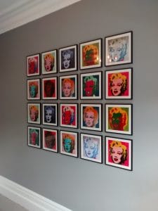 Picture wall ideas. A picture wall of twenty Andy Warhol prints, hung in a grid.