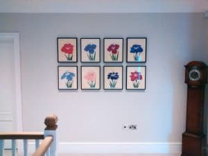 Picture wall ideas. Eight Japanese flower pictures hung in a grid formation.